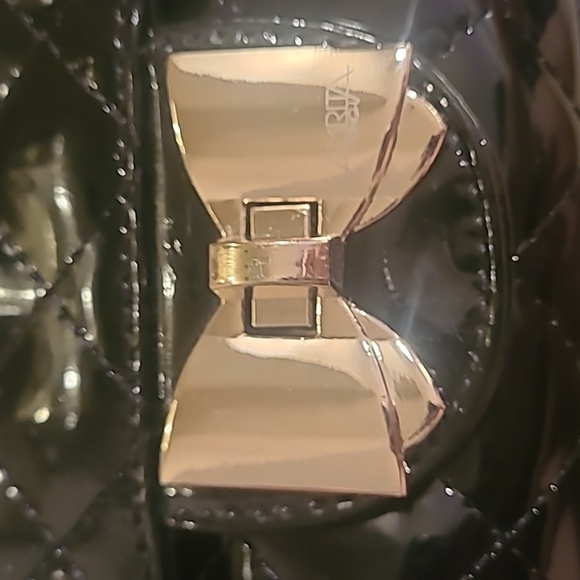 Black Quilted Handbag with Gold Bow Details - Picture 2 of 7